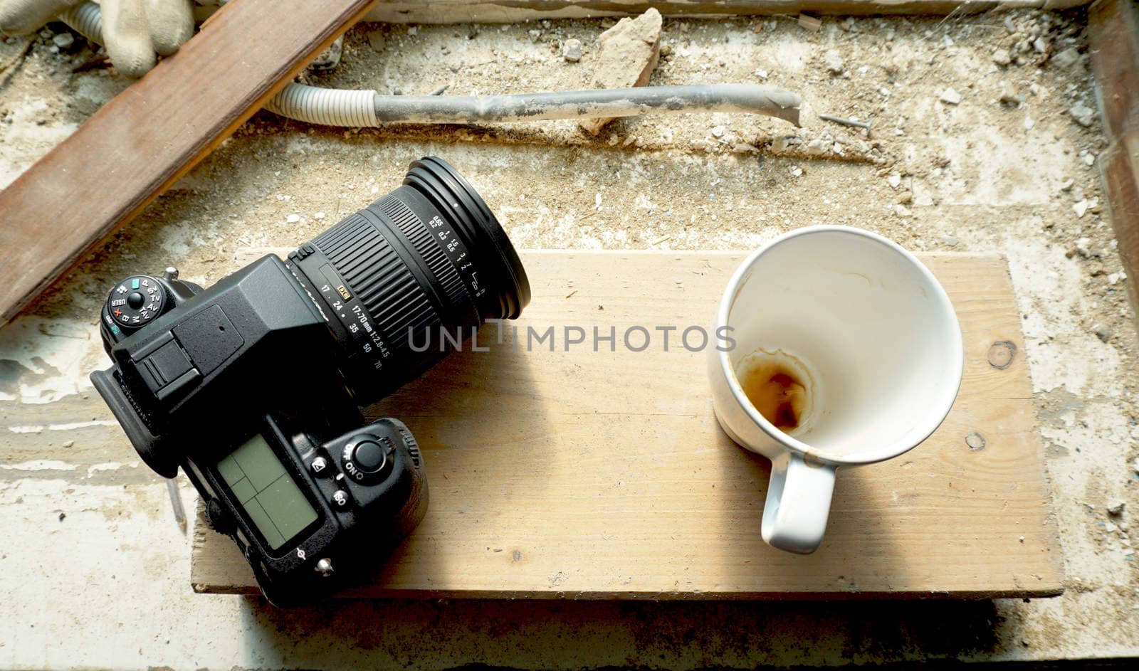 camera and coffee cup on site                               
