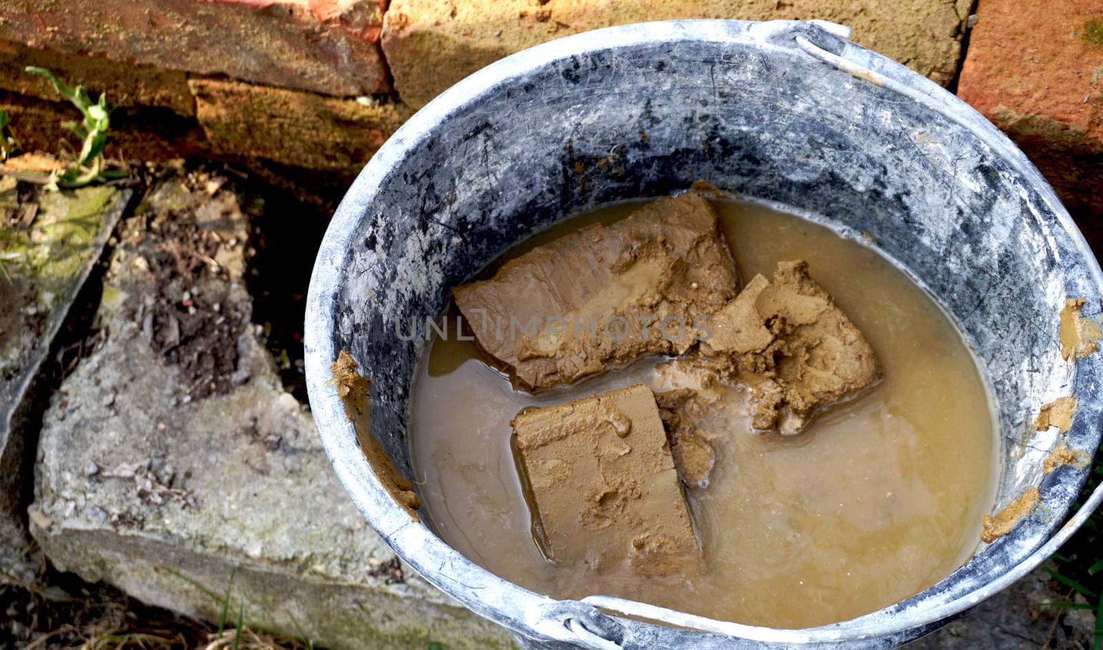 clay brick in water bucket                                