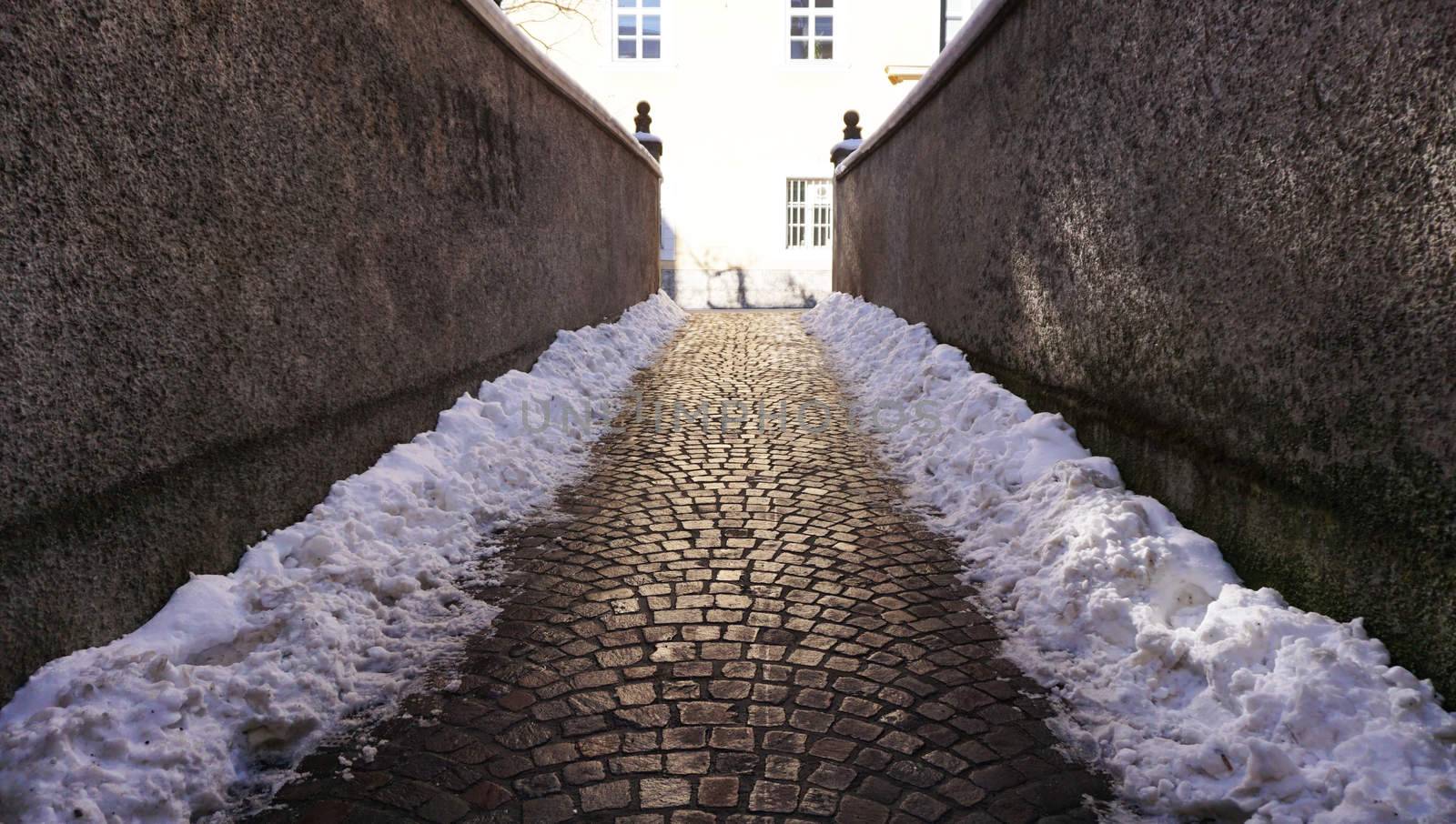 walkway with snow in oldtown by polarbearstudio