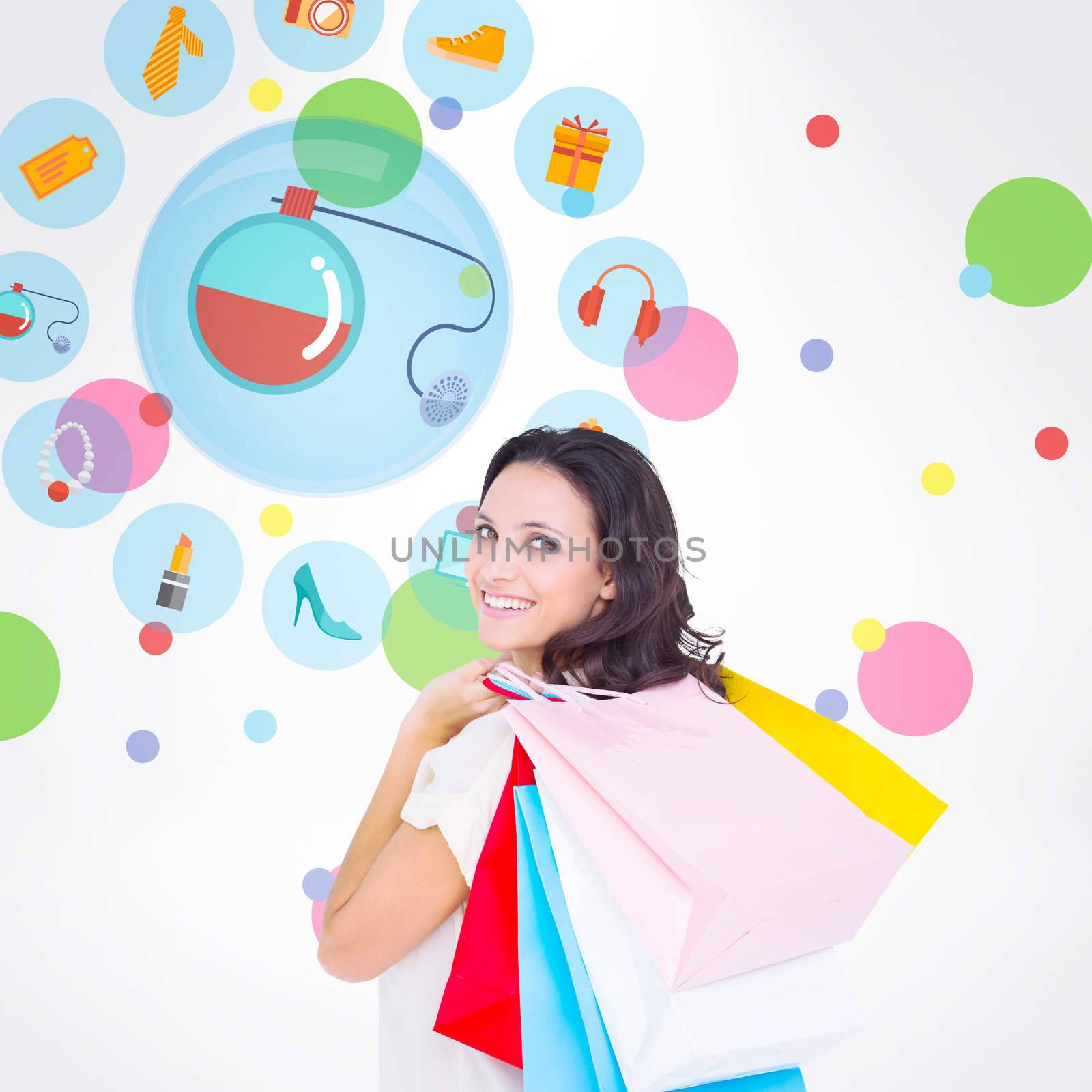 Composite image of pretty brunette with shopping bags by Wavebreakmedia
