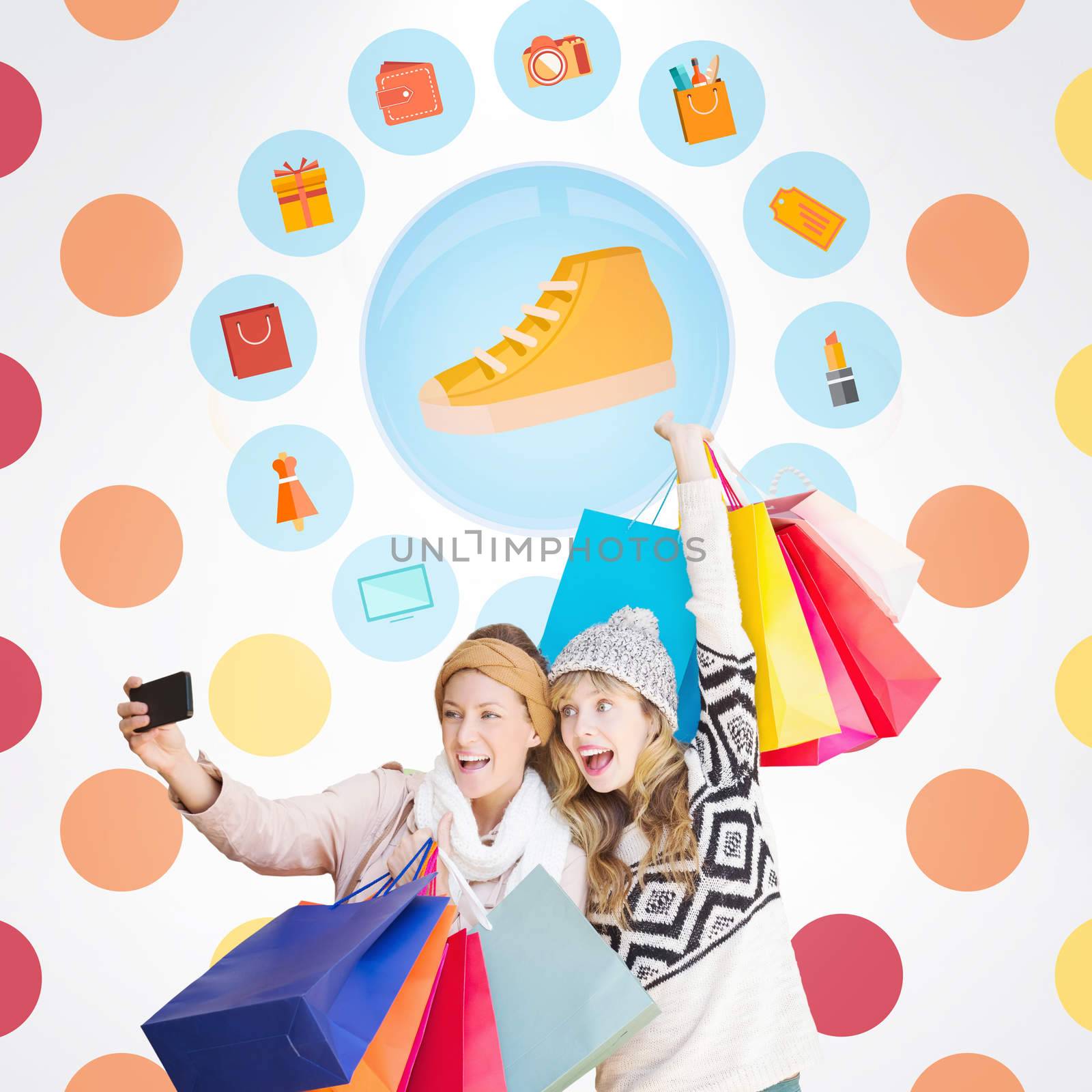 Smiling women making a selfie  against colorful polka dot pattern 