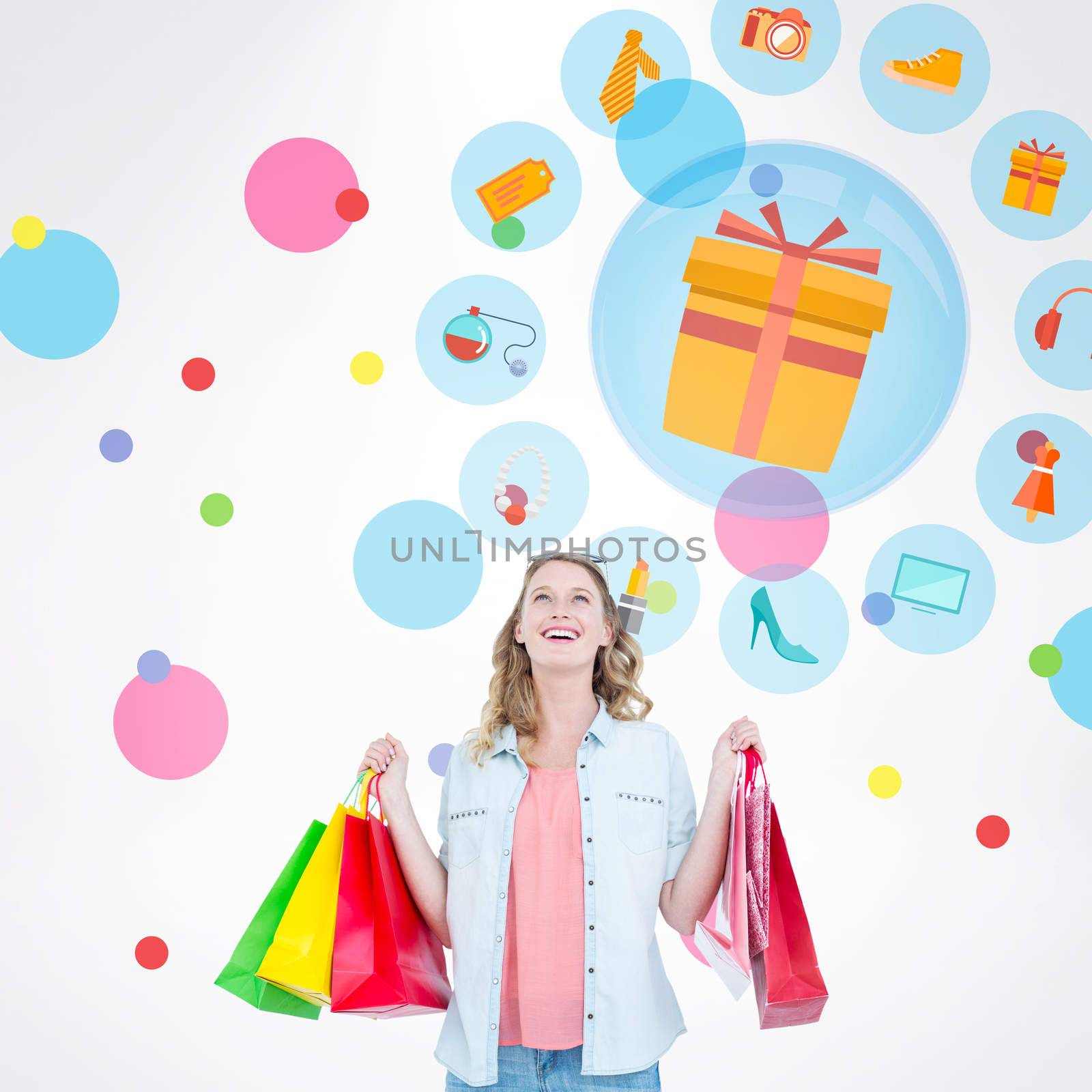 Composite image of woman holding some shopping bags by Wavebreakmedia