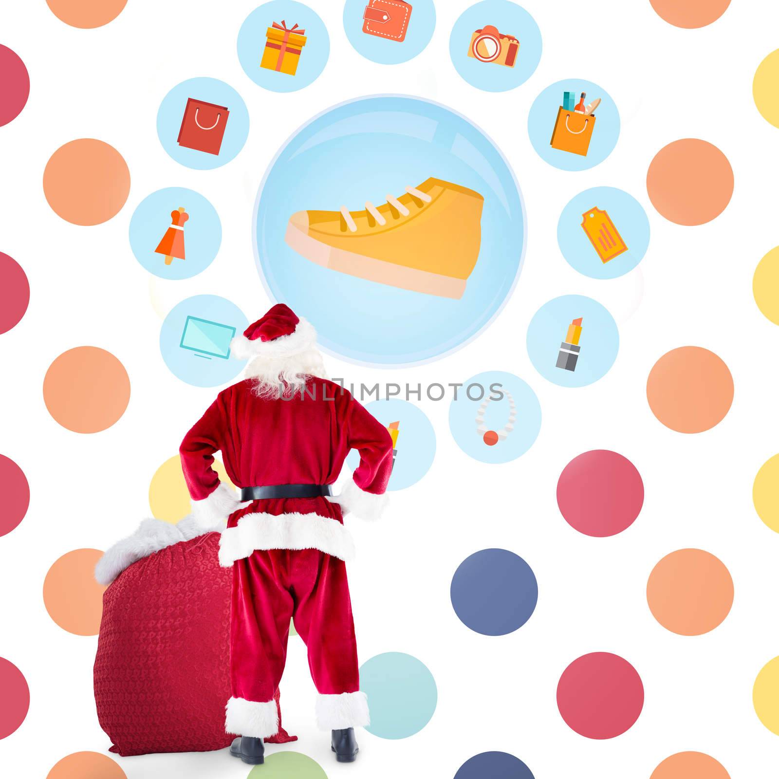 Santa with sack of gifts against colorful polka dot pattern 