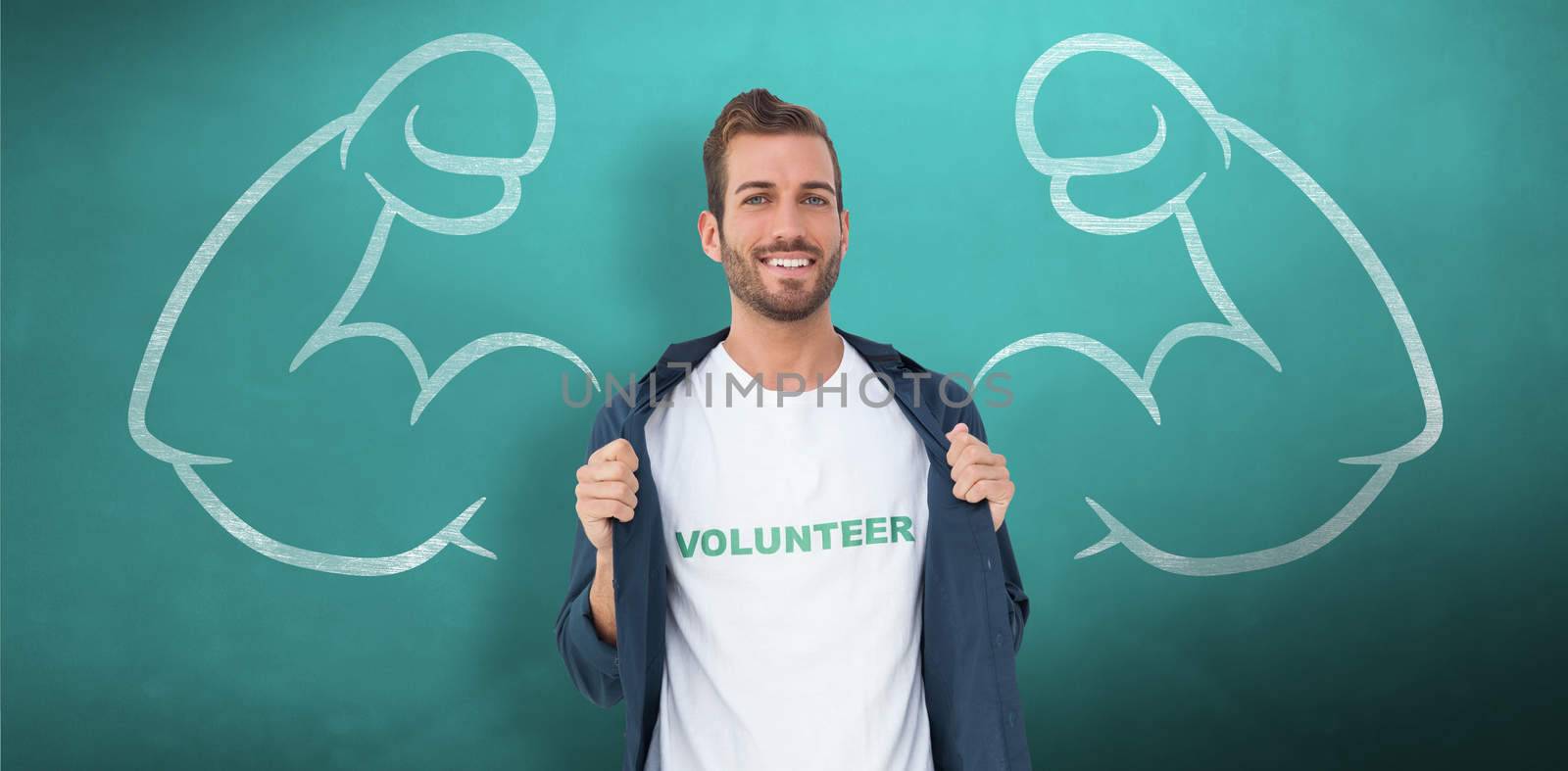 Portrait of a smiling young male volunteer against green chalkboard