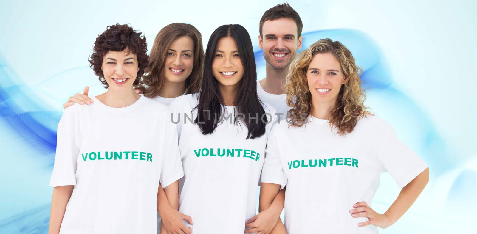 Group of people wearing volunteer tshirt against blue abstract design