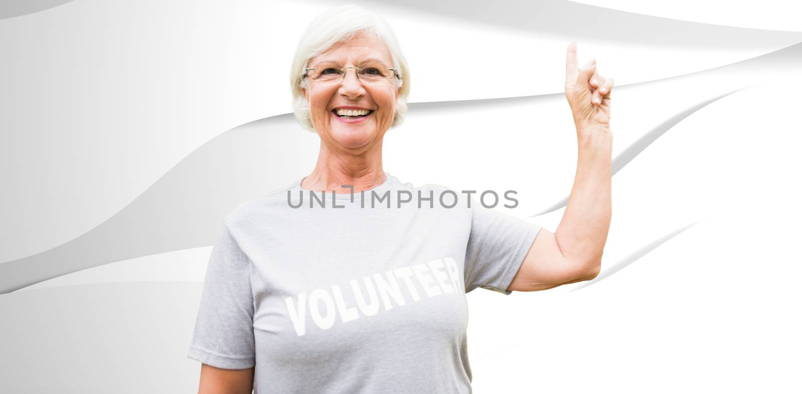 Composite image of happy volunteer grandmother with thumbs up  by Wavebreakmedia