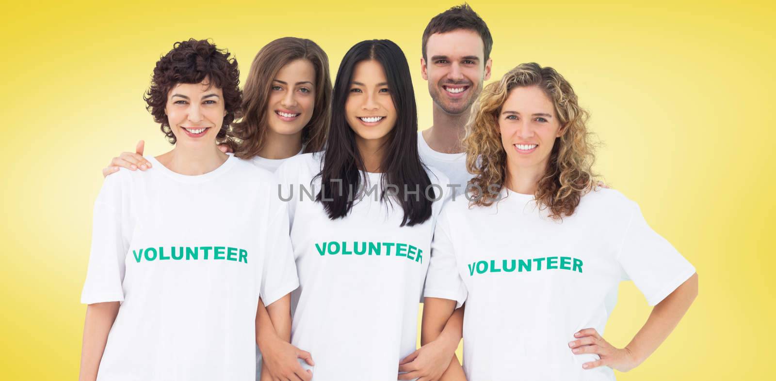 Composite image of group of people wearing volunteer tshirt by Wavebreakmedia