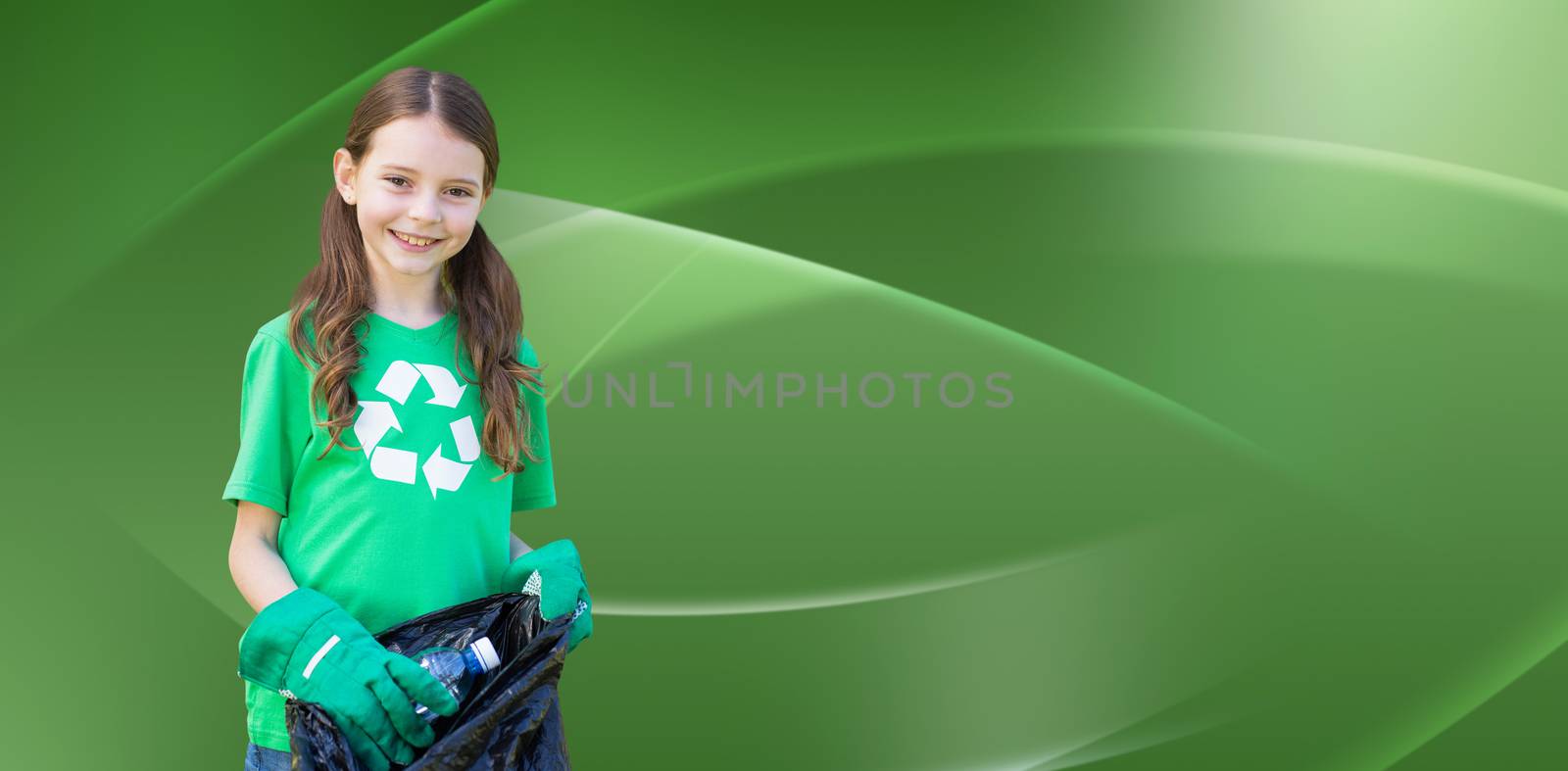 Happy little girl collecting rubbish  against abstract green design