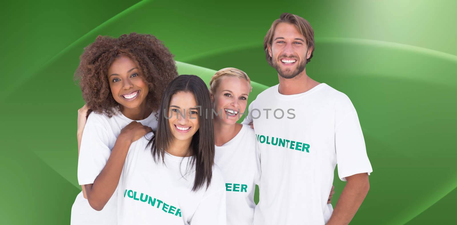 Smiling group of volunteers against abstract green design