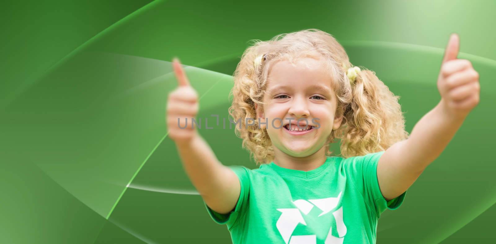 Happy little girl in green with thumbs up  against abstract green design