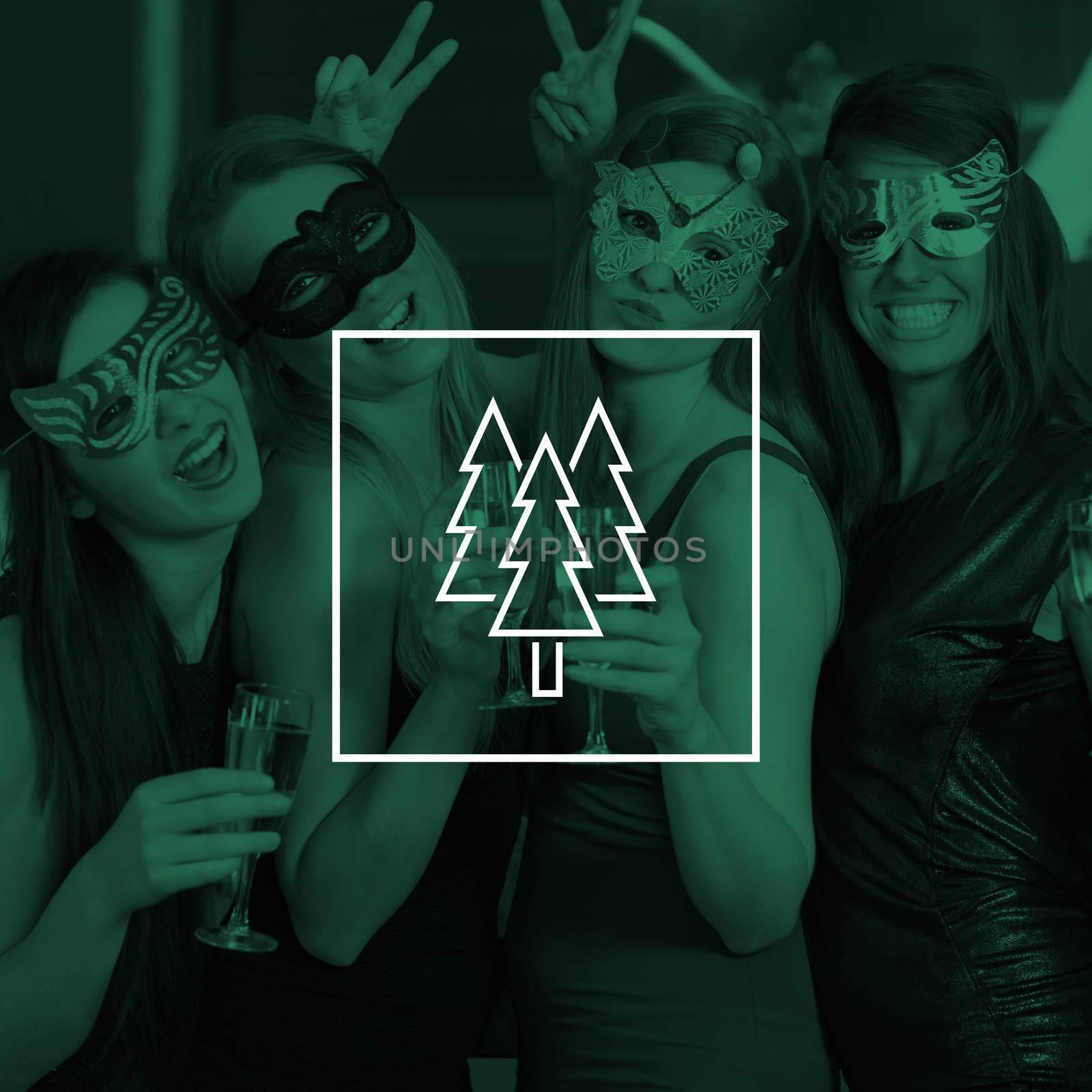 Attractive women wearing masks holding champagne against christmas trees