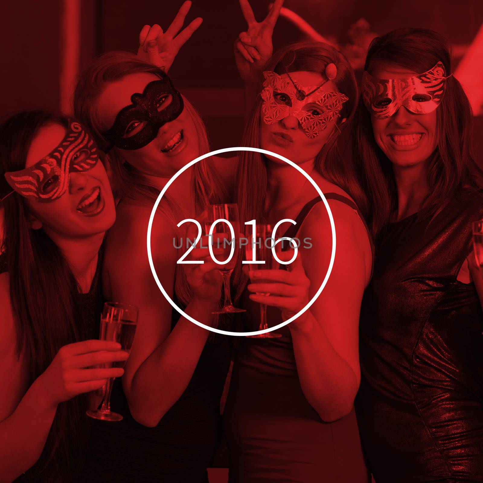 Attractive women wearing masks holding champagne against new year graphic