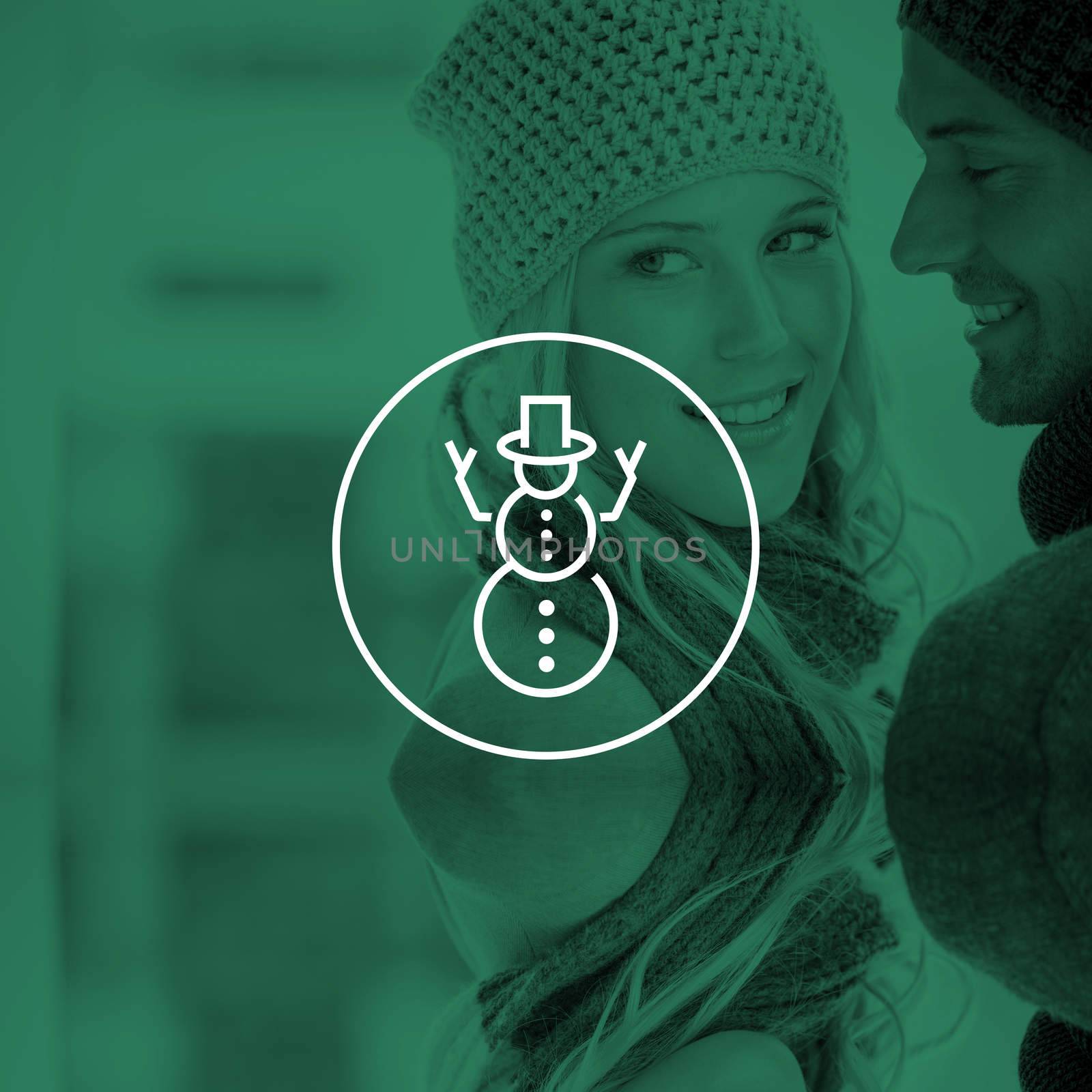 Couple in warm clothing hugging against snowman