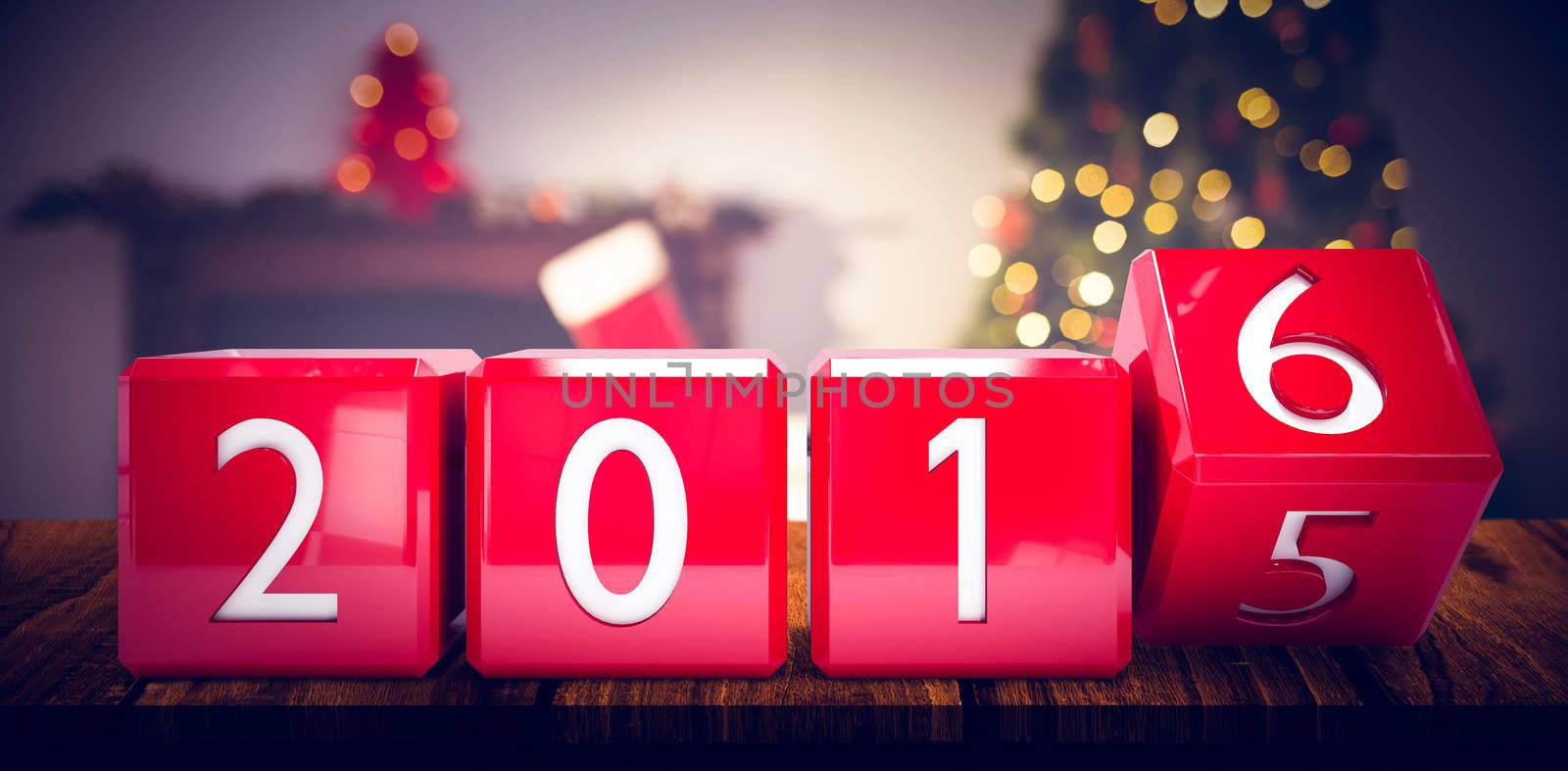 2016 in red blocks against christmas tree with presents near the fireplace