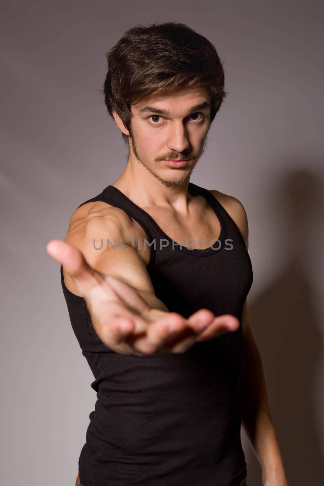 young casual happy man on a black background