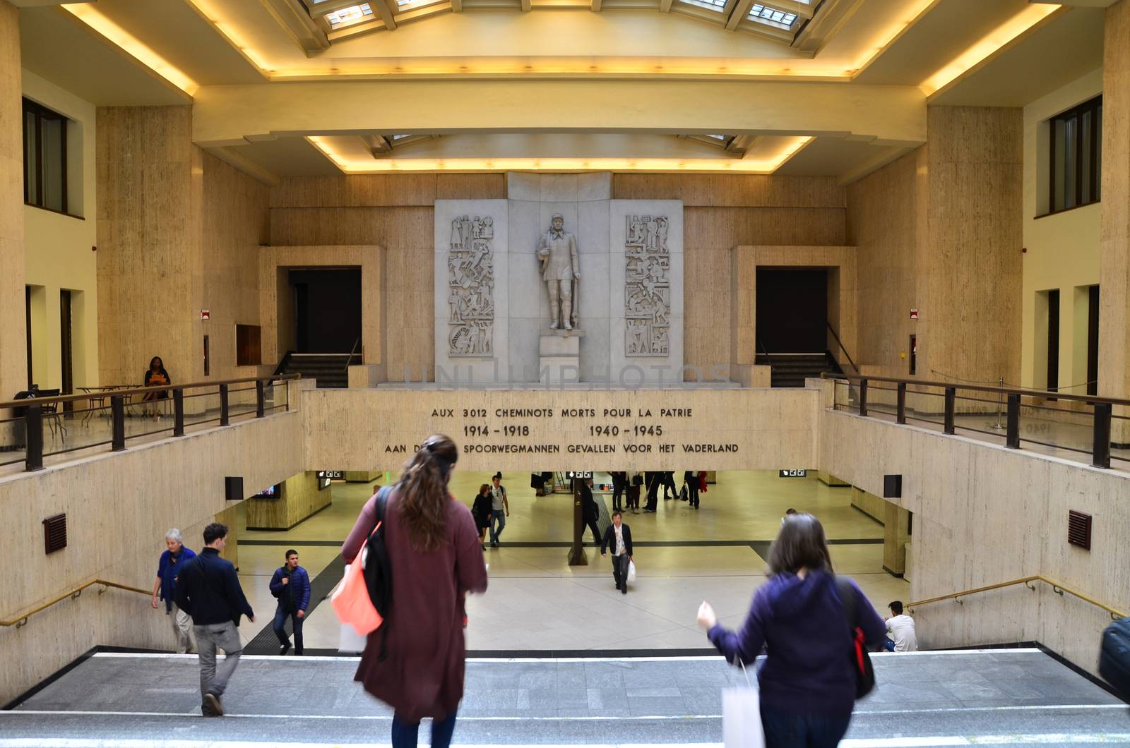 Brussels, Belgium - May 12, 2015: Travellers in the main lobby of Brussels Central Train Station by siraanamwong