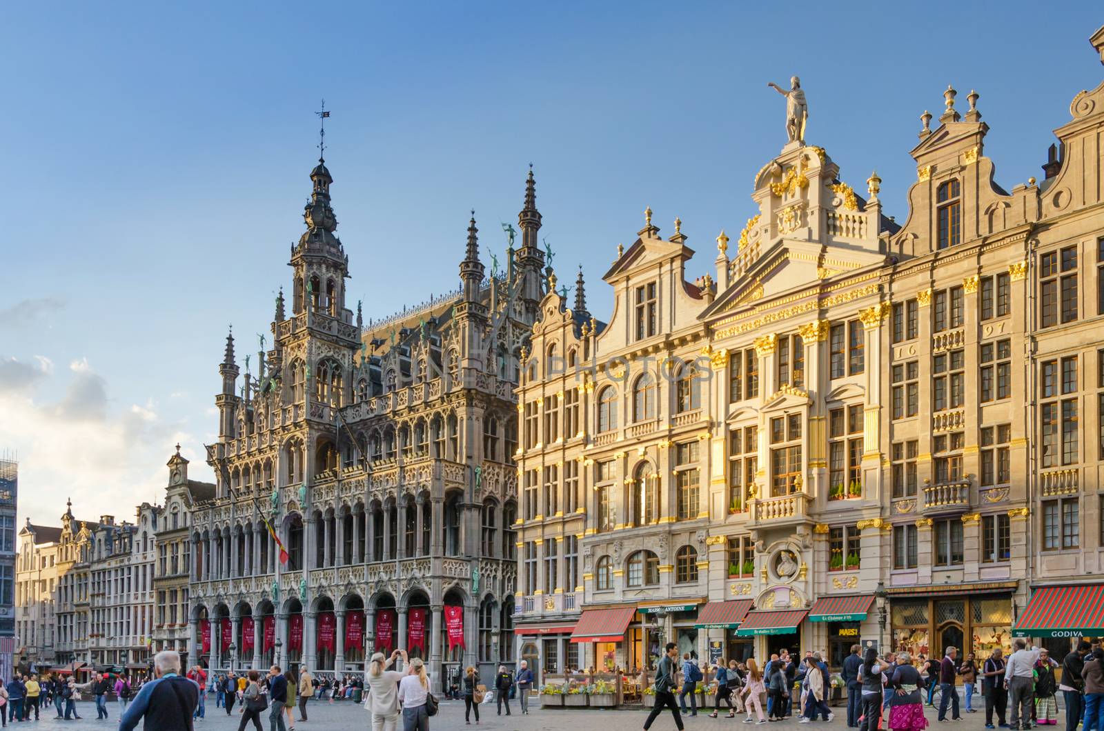 Brussels, Belgium - May 13, 2015: Many tourists visiting famous Grand Place the central square of Brussels by siraanamwong