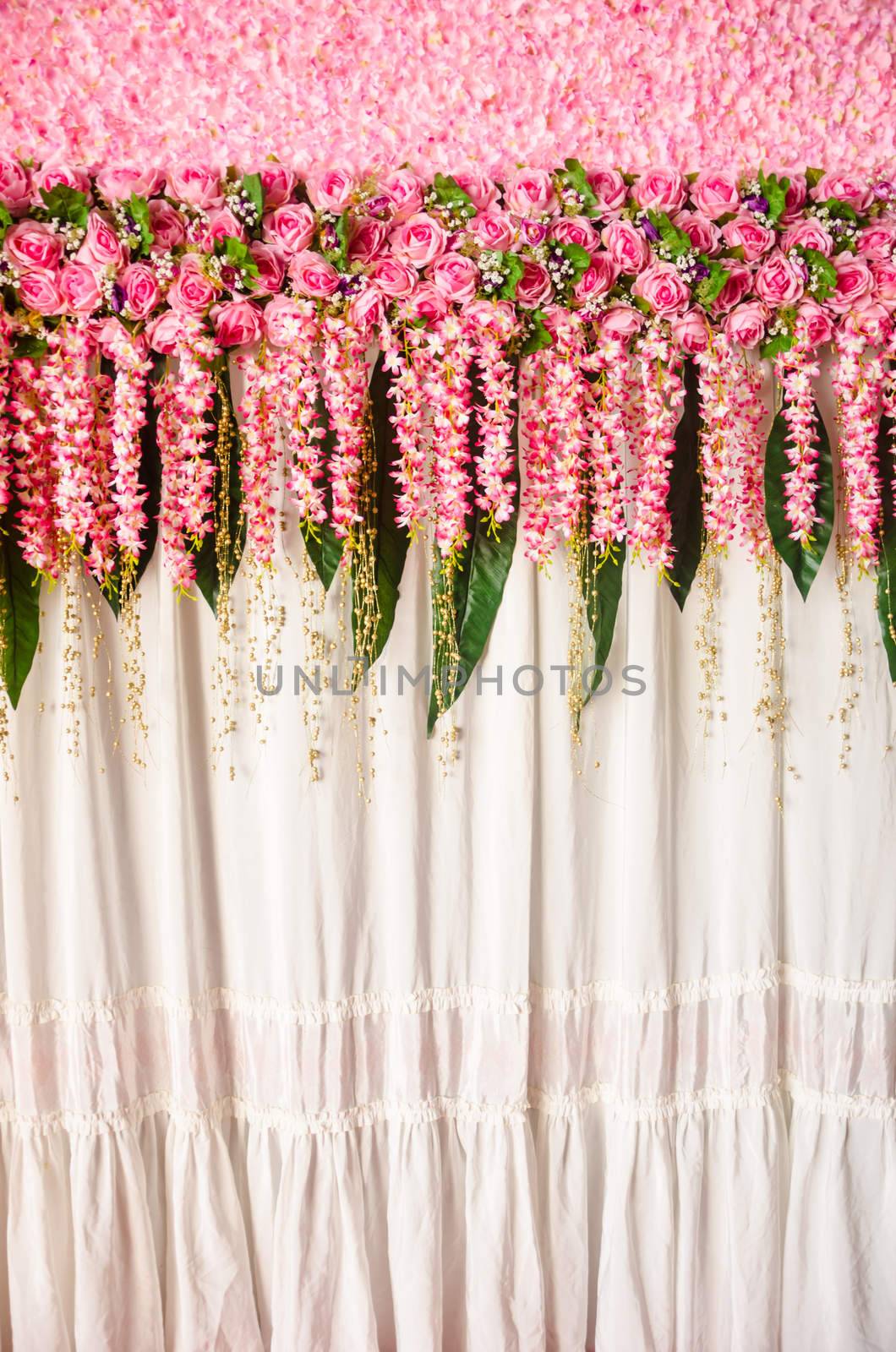 Colorful backdrop pink rose flowers ready for wedding ceremony.