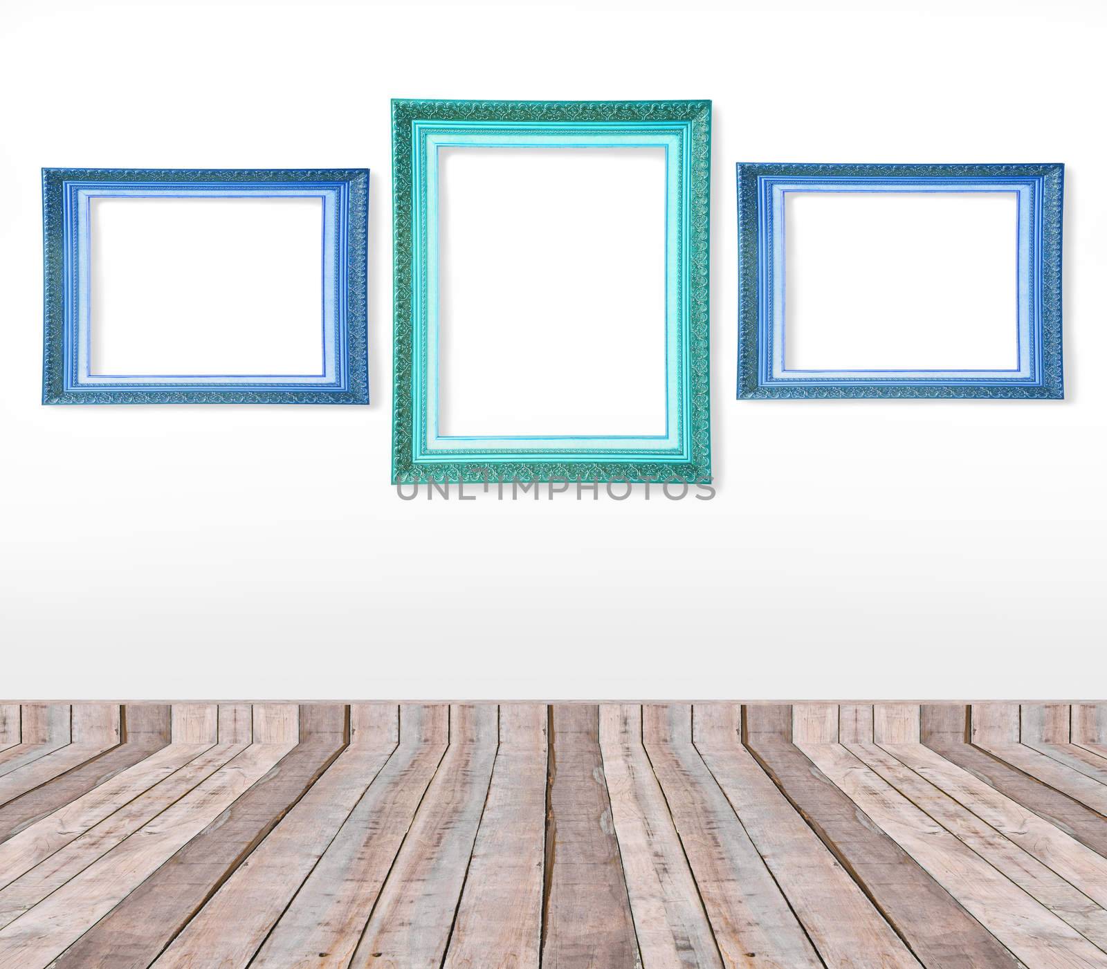 Set of blue vintage picture frames on the wall inside the room