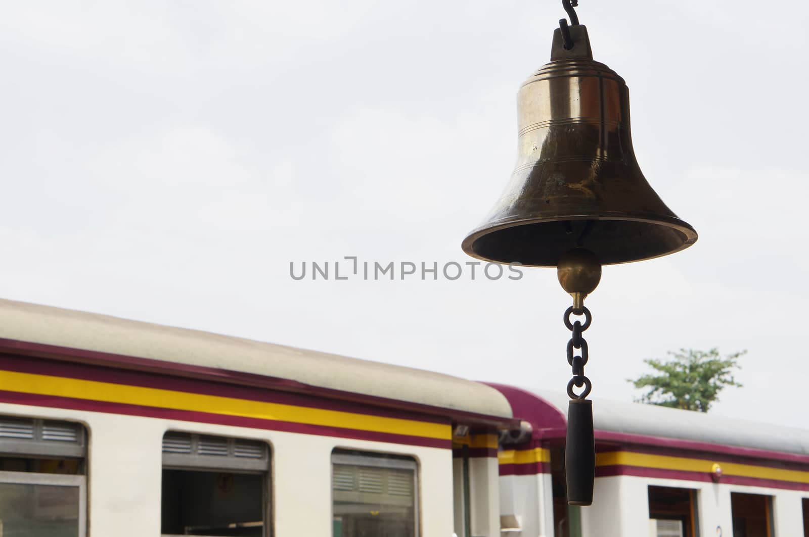 Thai traditional golden bell at train station in afternoon on bogie background.