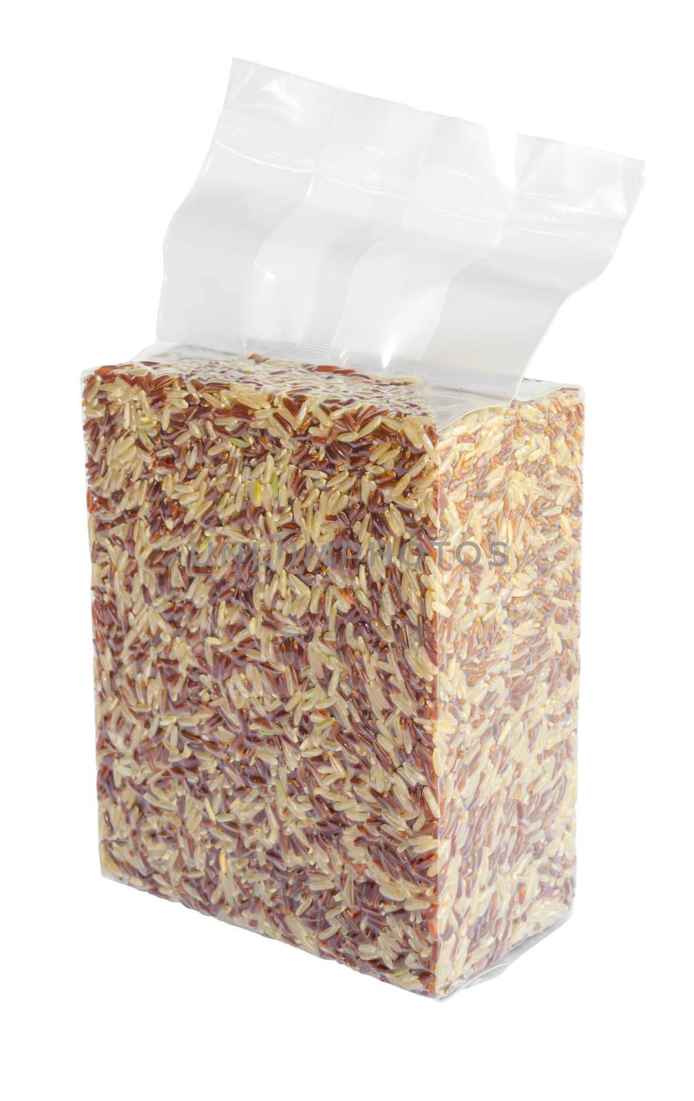 Brown rice in vacuum plastic bag isolated on white background, clipping path 1 Kg.