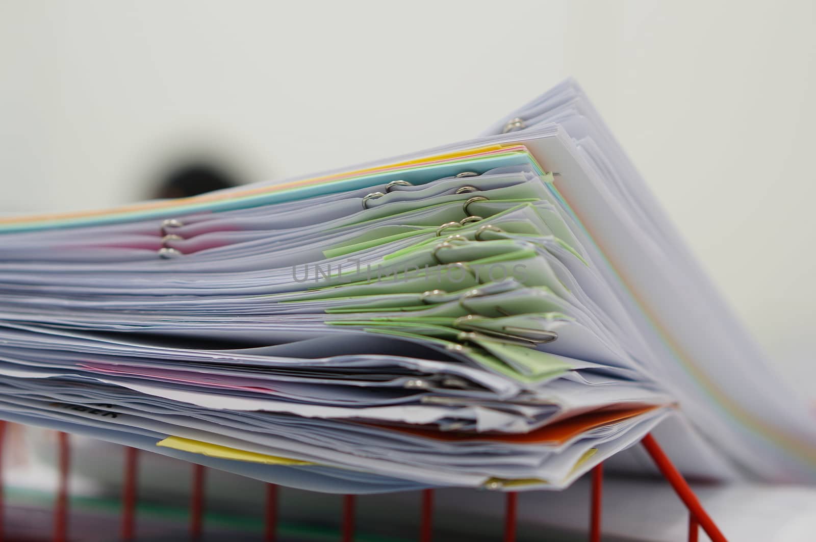 Pile of documents and blur notebook in basket by ninun