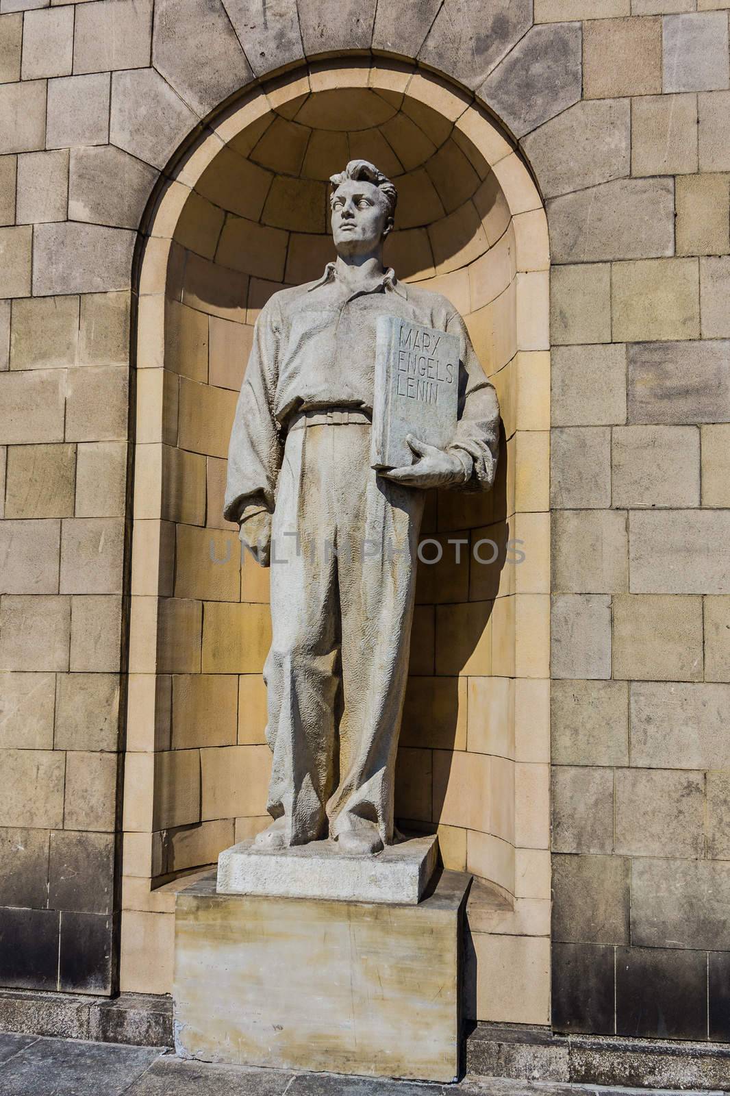 Socialist realism statue on the facade of the Palace of Culture and Science in Warsaw, built as a gift for Poland from USSR in the middle of fifties of 20th century.