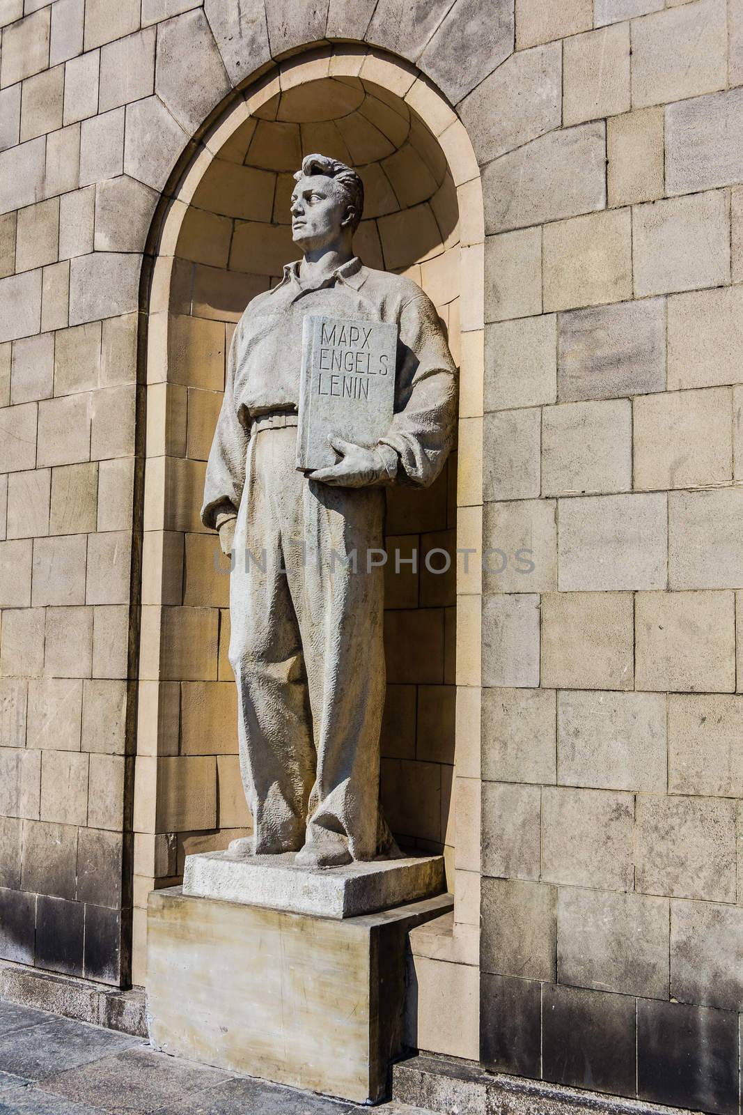 Socialist realism statue on the facade of the Palace of Culture and Science in Warsaw, built as a gift for Poland from USSR in the middle of fifties of 20th century.