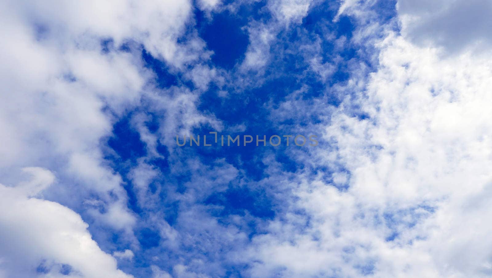 clouds and blue sky background by polarbearstudio