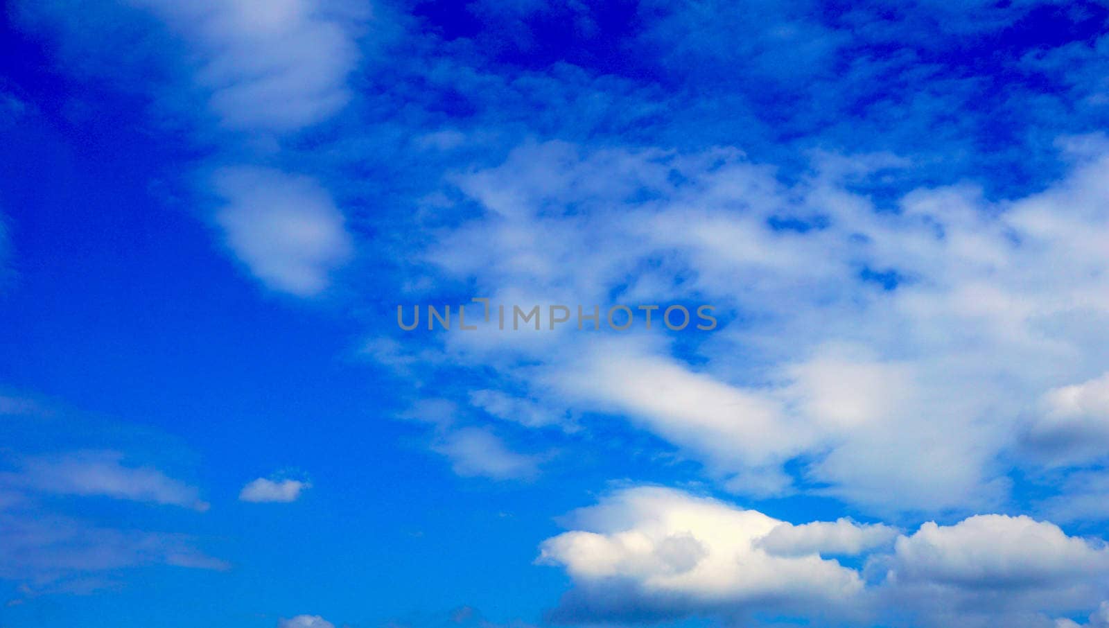Sky blue and clouds background by polarbearstudio