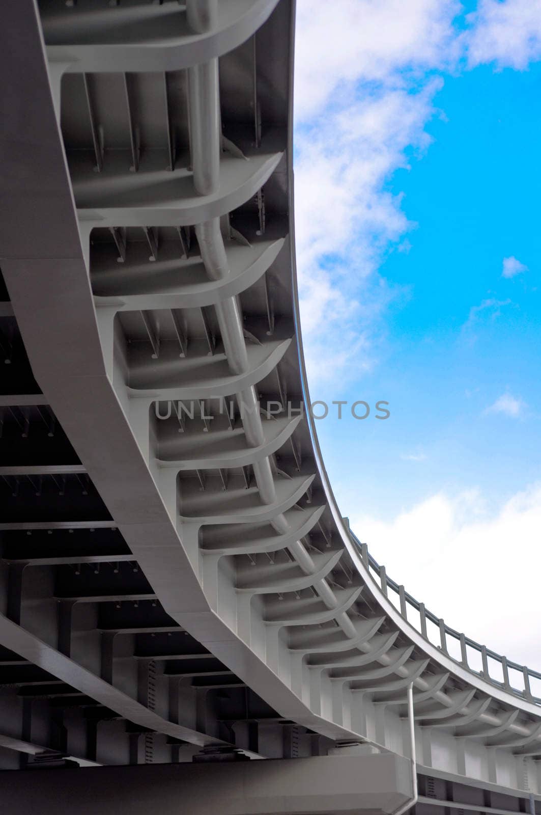 automobile overpass on background of blue sky with clouds. bottom view