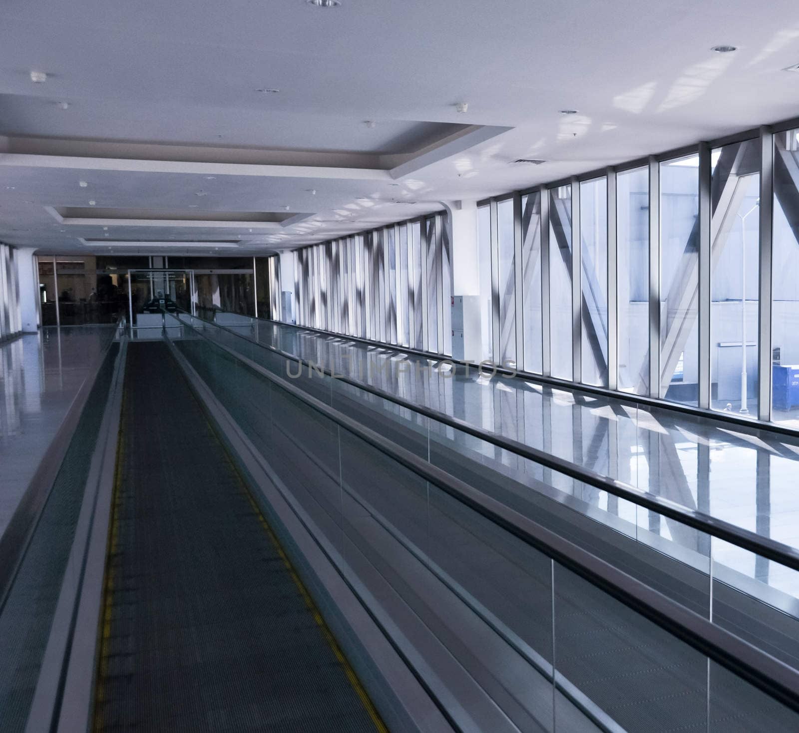 the empty escalator inside the contemporary building