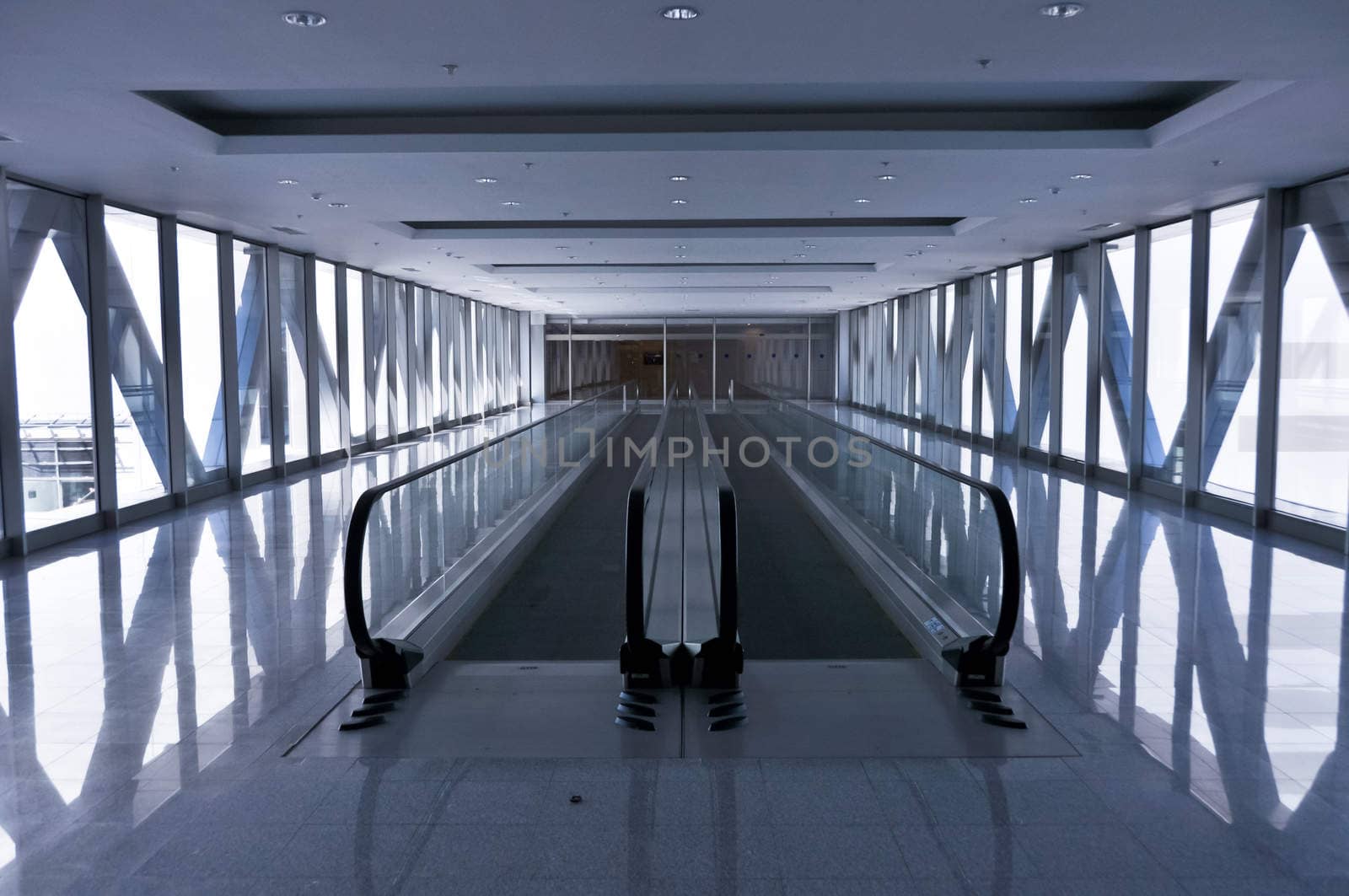 the empty escalator inside the contemporary building