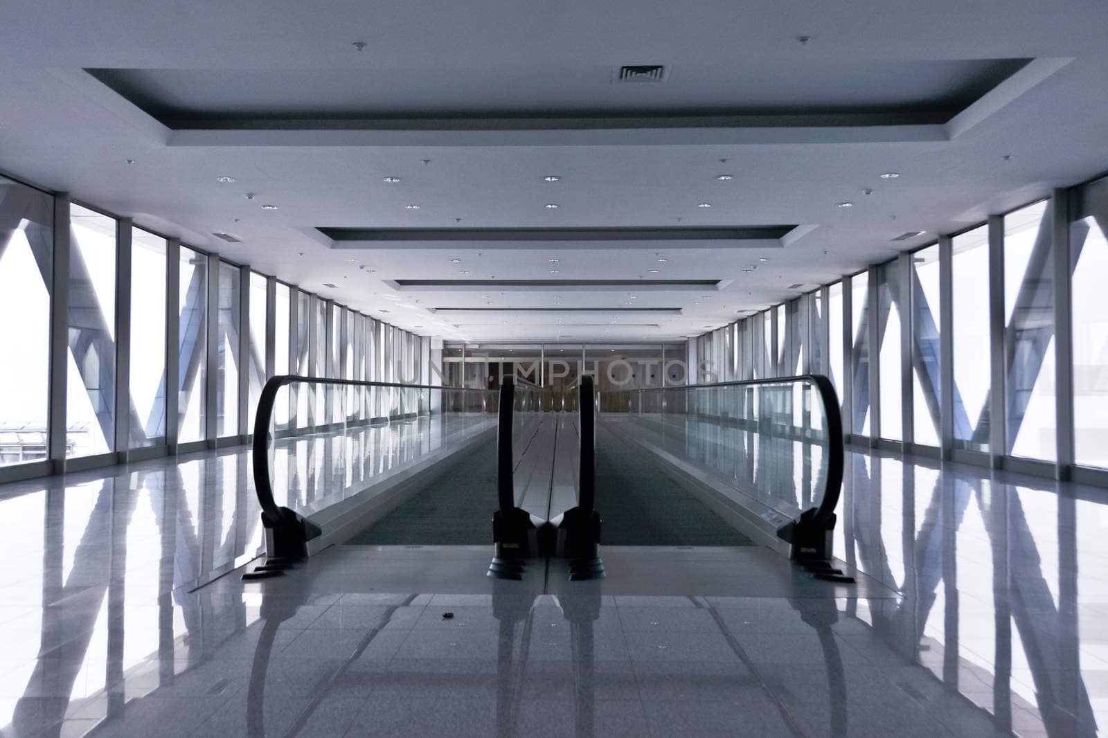 the empty escalator inside the contemporary building
