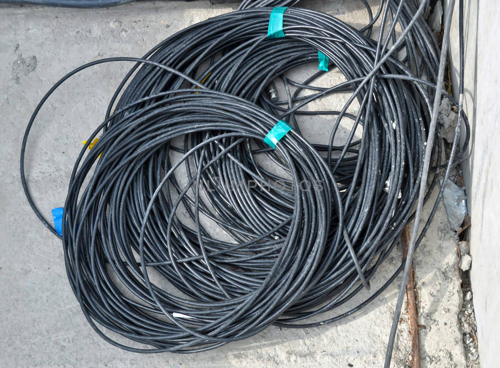 the coil of black electrical cable