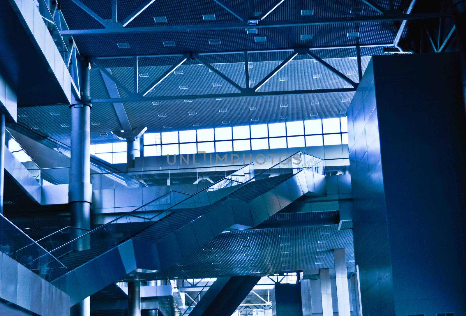 interior of the contemporary  business-center with escalators