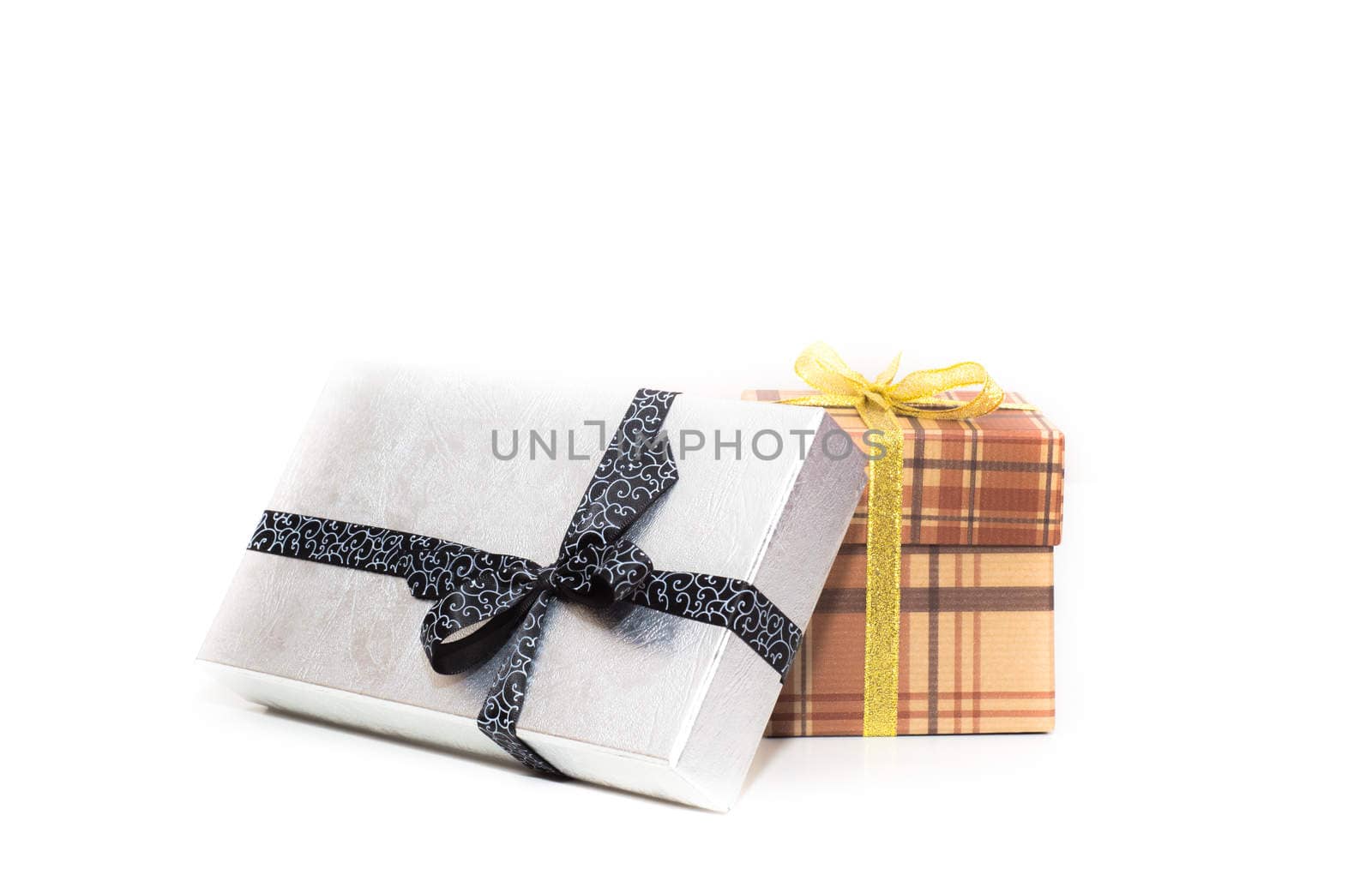 brown and silver gift box with bow on white background by vlaru