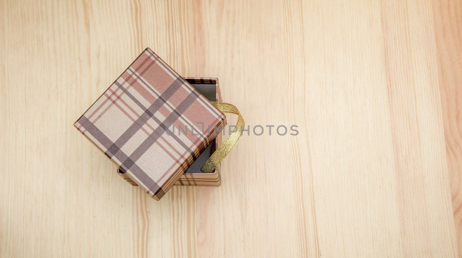 the gift box on a wooden table