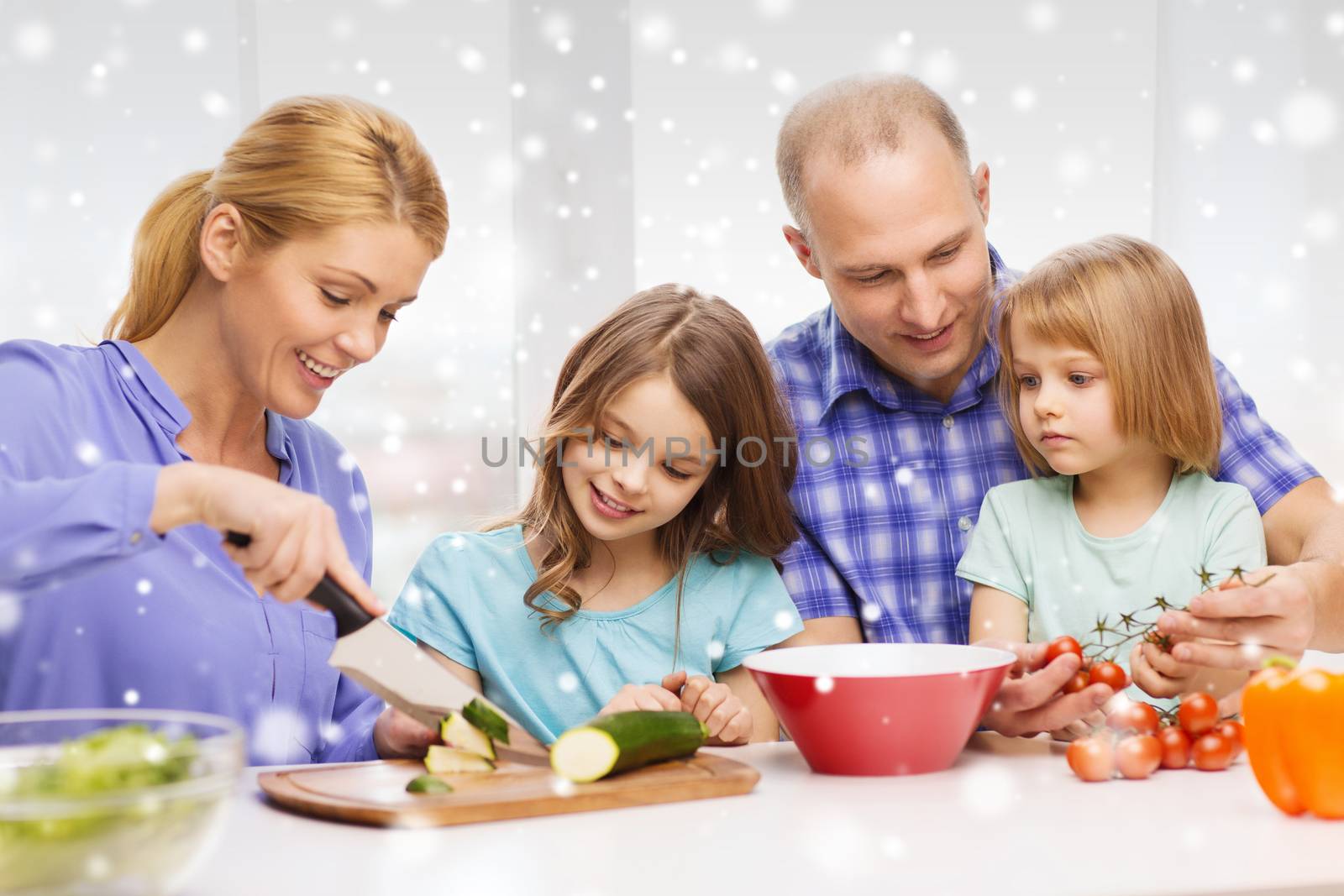 food, family, children, happiness and people concept - happy family with two kids making dinner at home