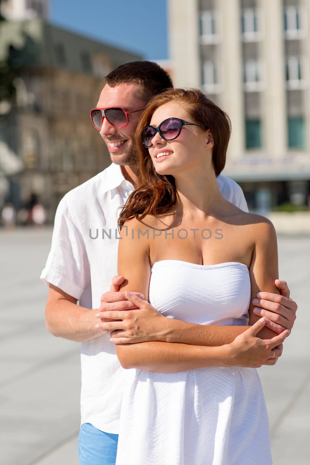 smiling couple in city by dolgachov