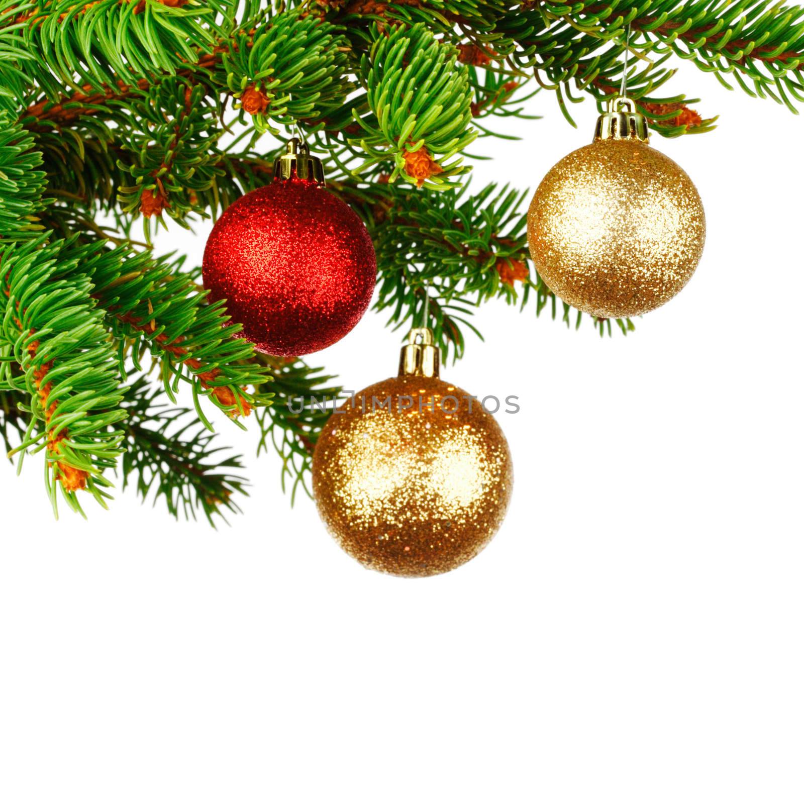Christmas tree branch with decoration ball isolated on white