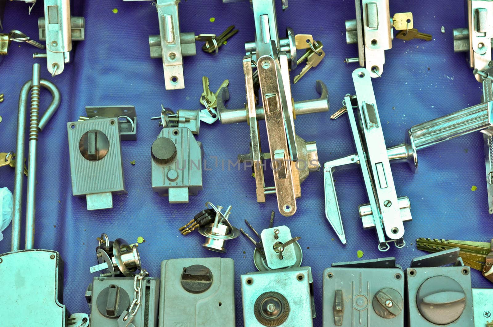 many Old door locks on open-air bazaar.JPG