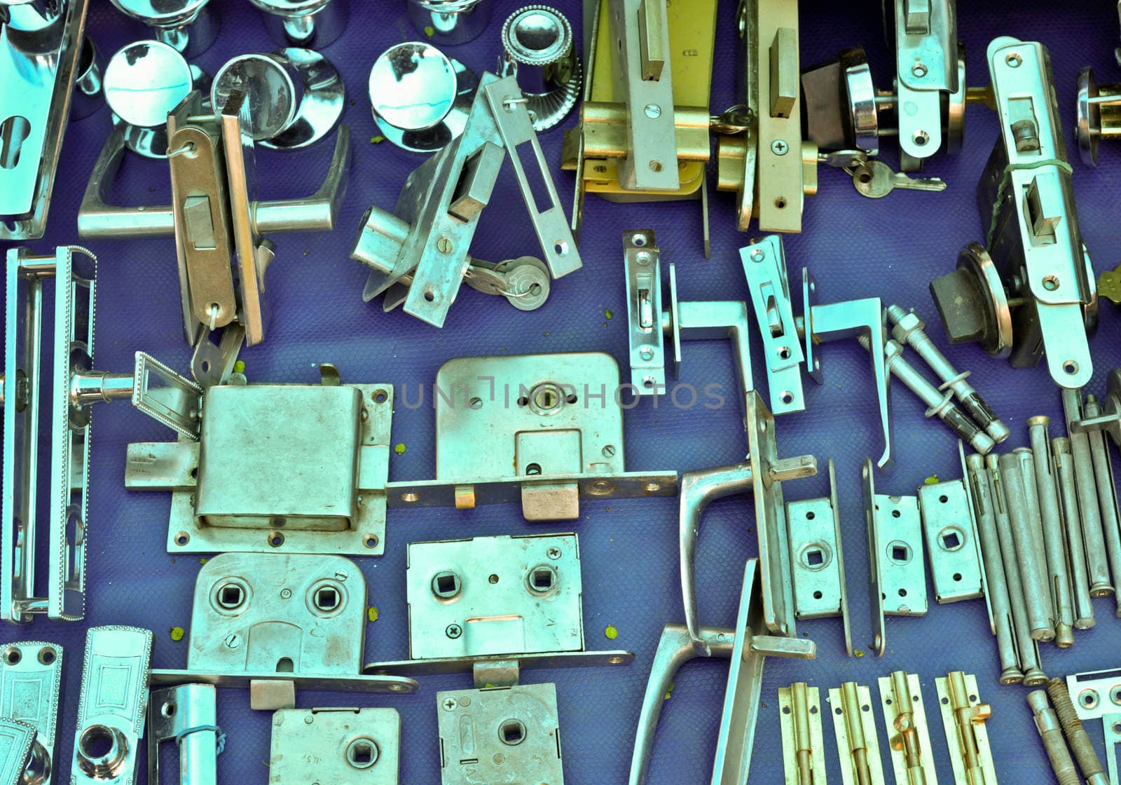 many Old door locks on open-air bazaar.JPG