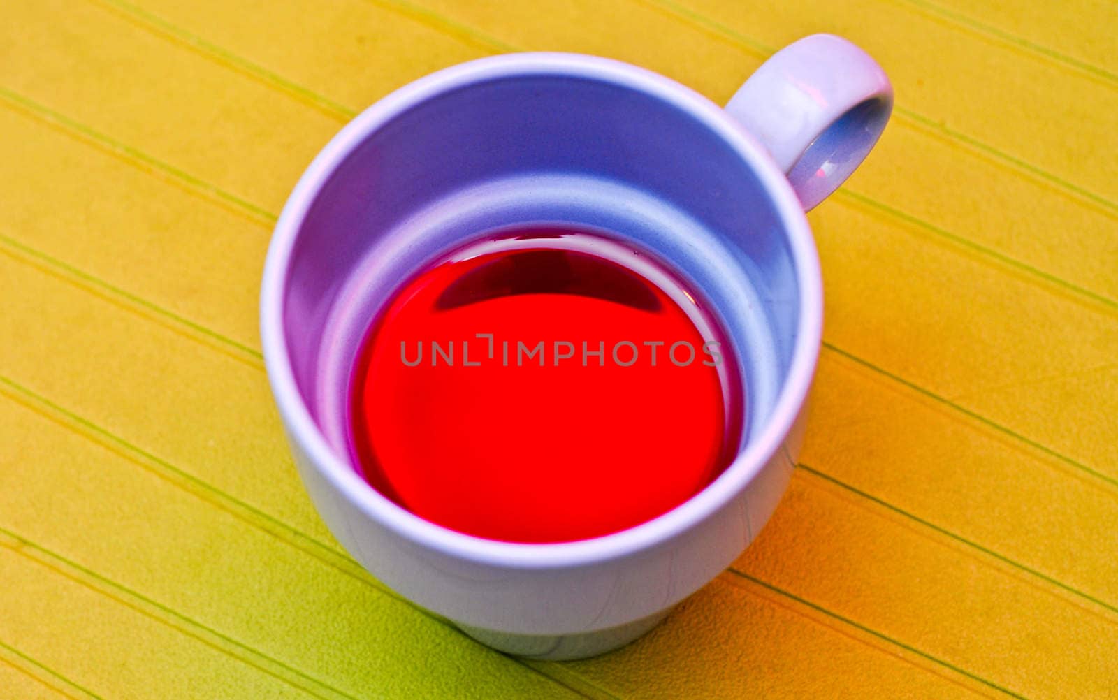 Blue cup with a compote on the green napkin by vlaru