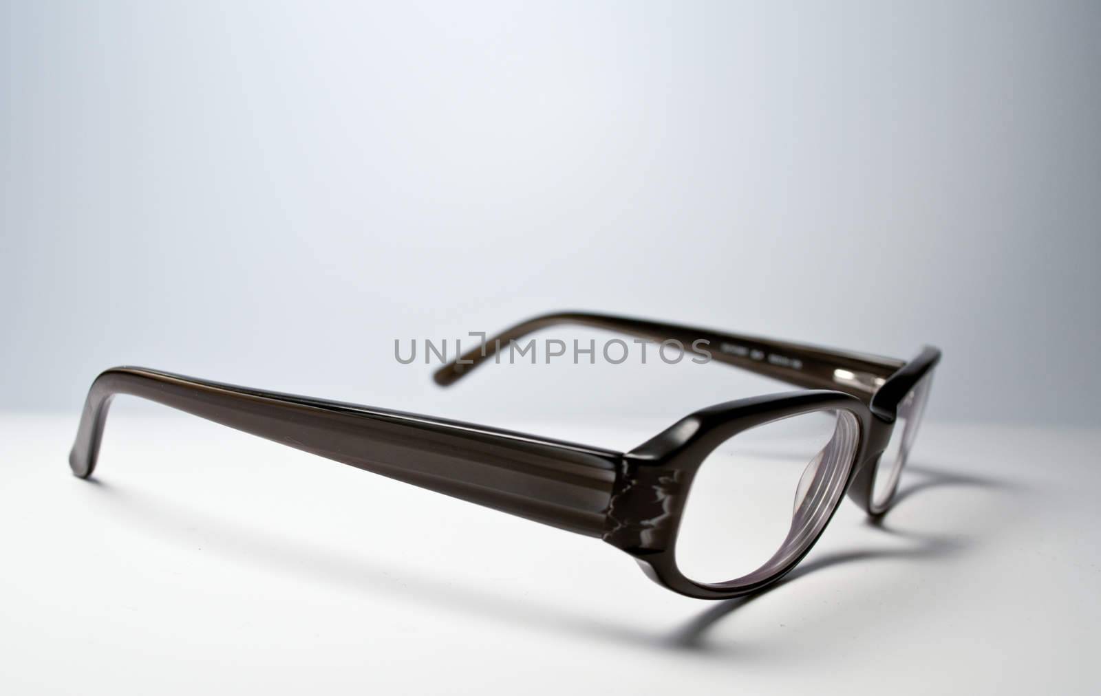 Black glasses over white background