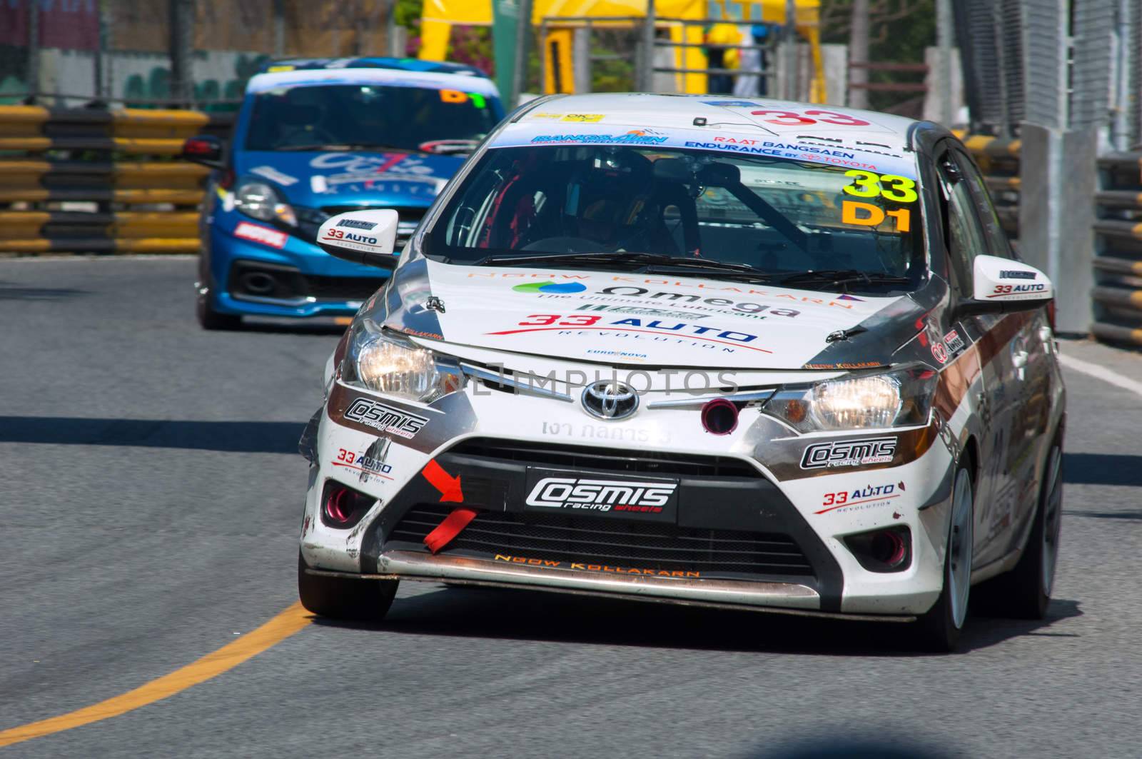 Bang Saen, Thailand - November 27, 2015: A Toyota Vios leading a slower Honda Brio at the 6 hour race street race during Bang Saen Speed Festival at Bang Saen, Chonburi, Thailand.