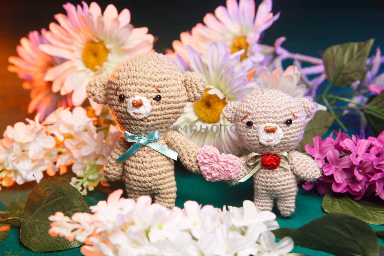 Concept: love, relationship. Couple of knitted bears holding hands by mrakor