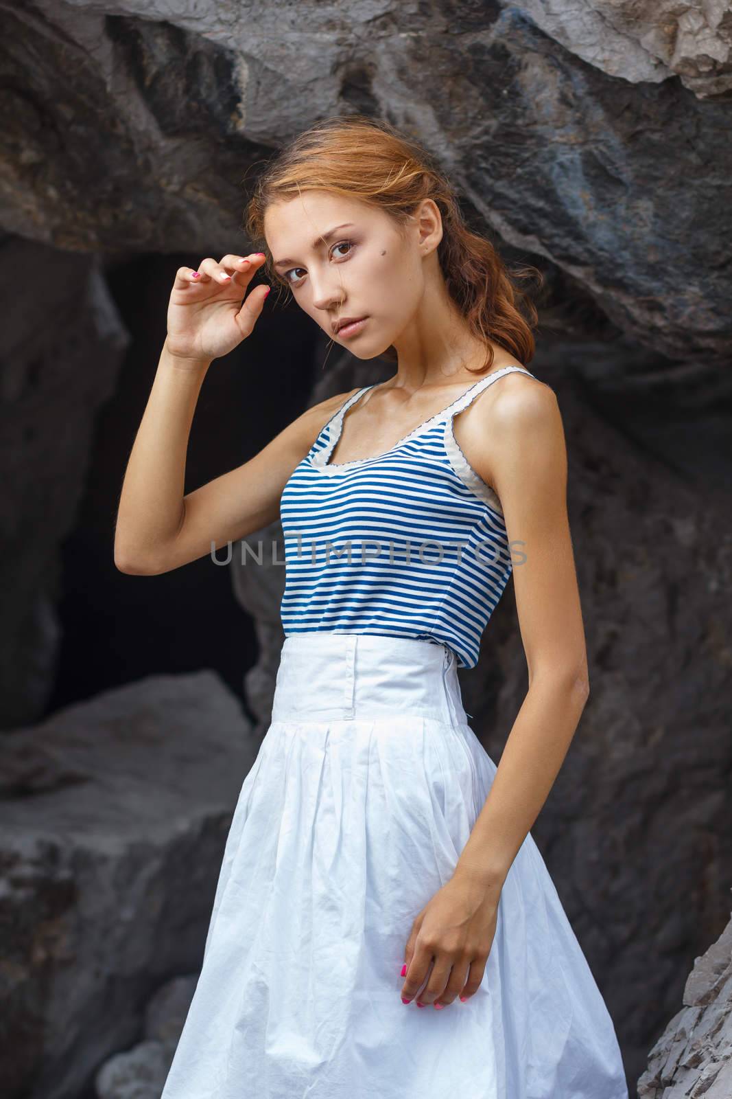 Young teen posing on stones at fashion photoshoot by mrakor