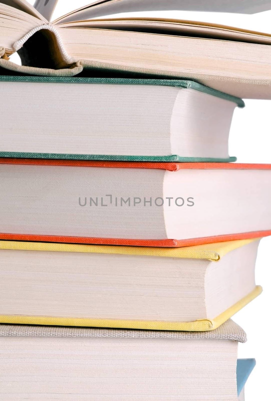 Column of books isolated on white background.