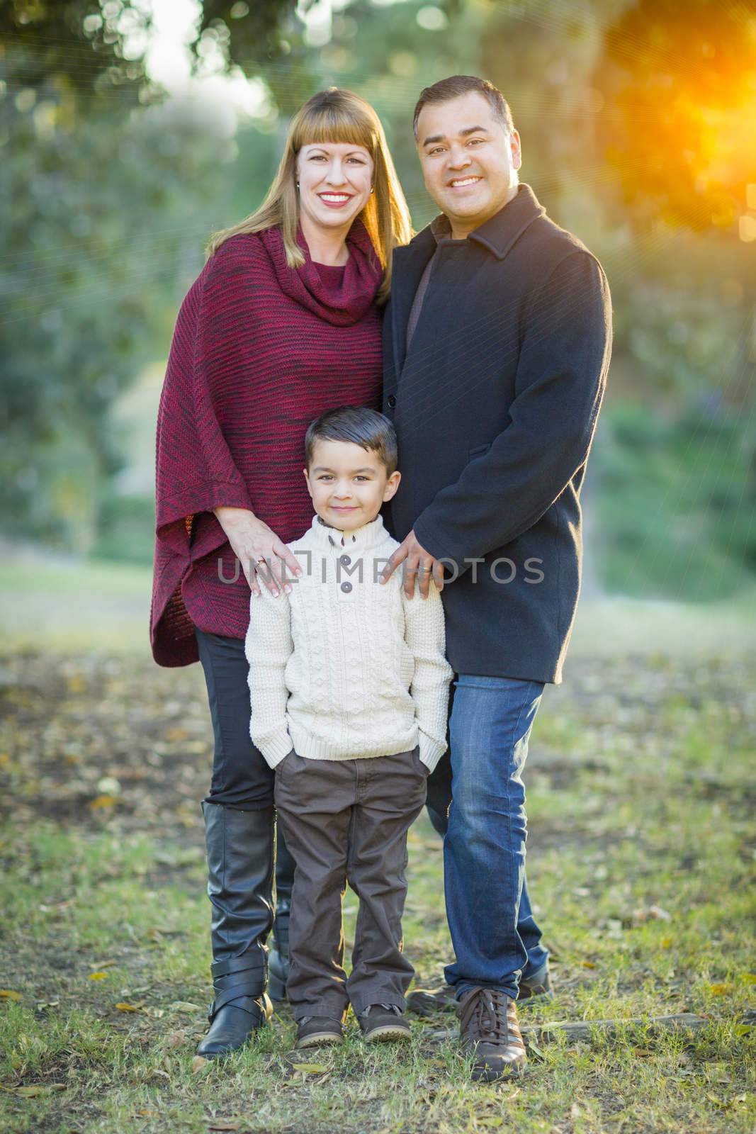 Happy Attractive Young Mixed Race Family Portrait Outdoors.